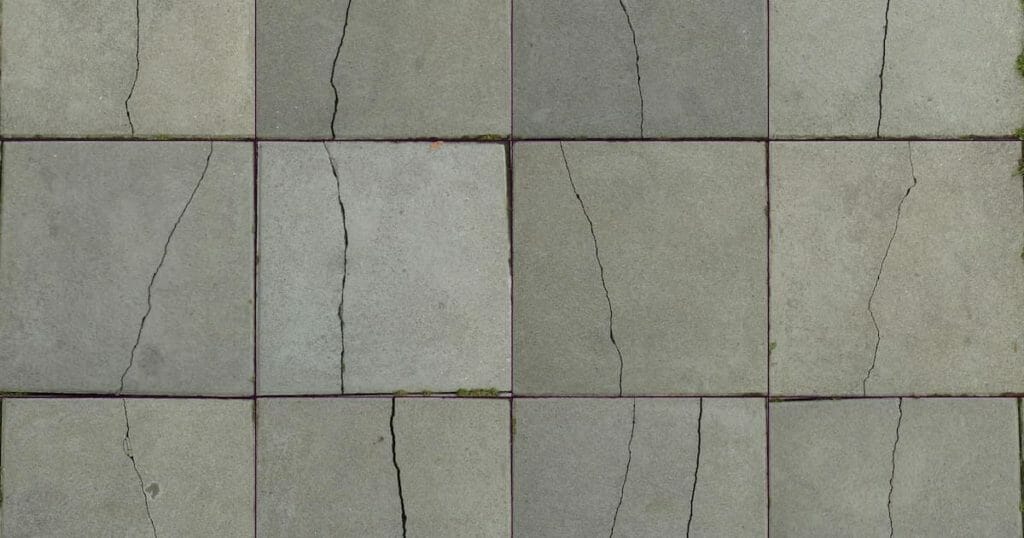 A series of cracked tiles most likely caused by foundation problems.